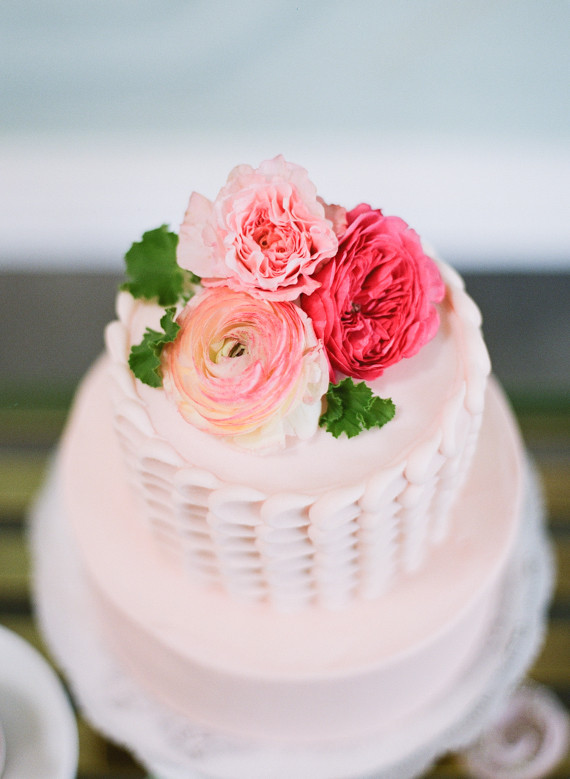 Light pink cake with flower cake topper