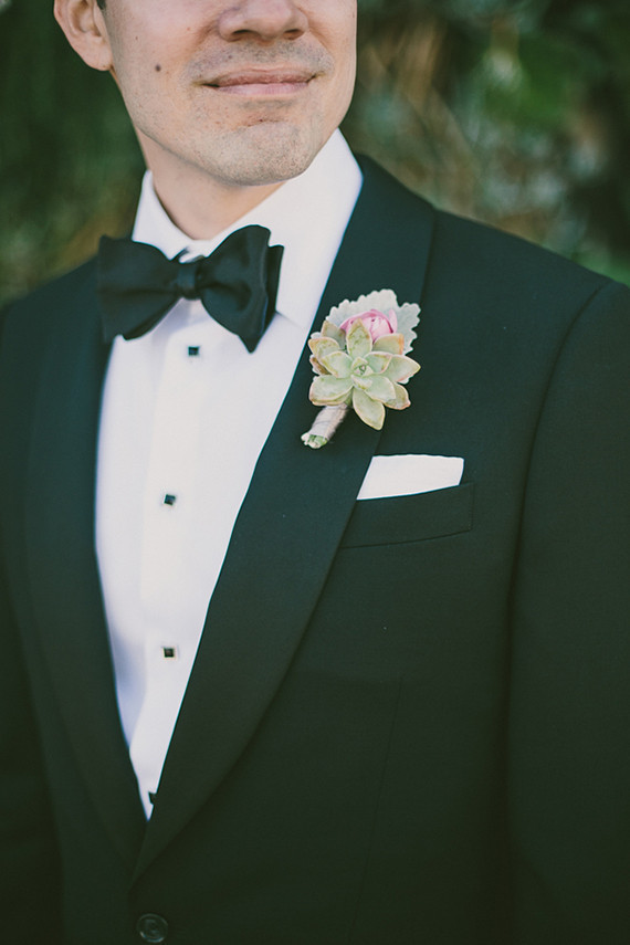 Succulent boutonniere and black bow tie