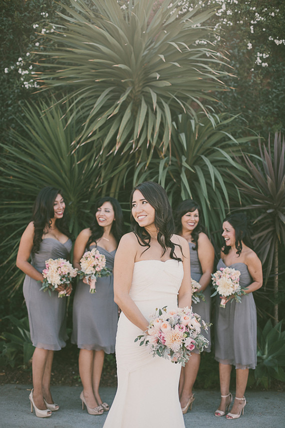 Grey bridesmaid dresses with light pink bouquets