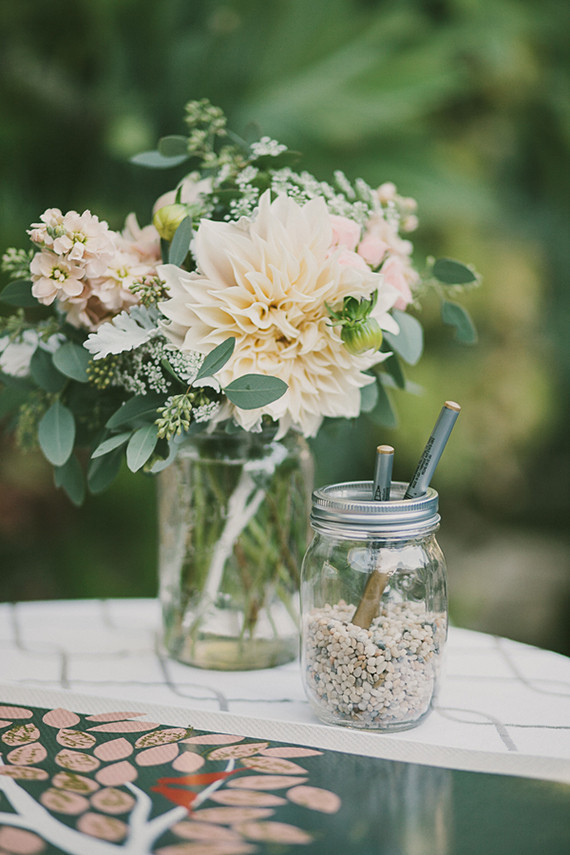 Rustic floral decor on guestbook table