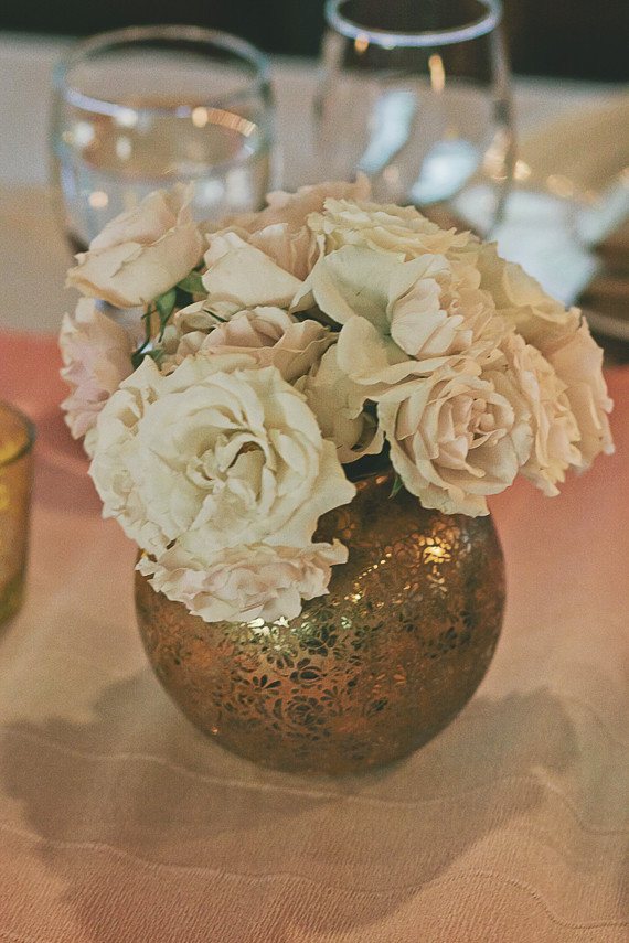 Gold vase with white flowers