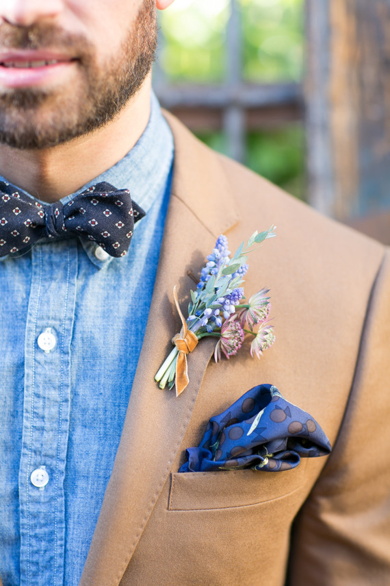 Tan blazer with blue bow tie