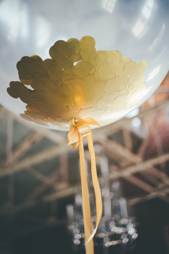clear balloon with gold confetti