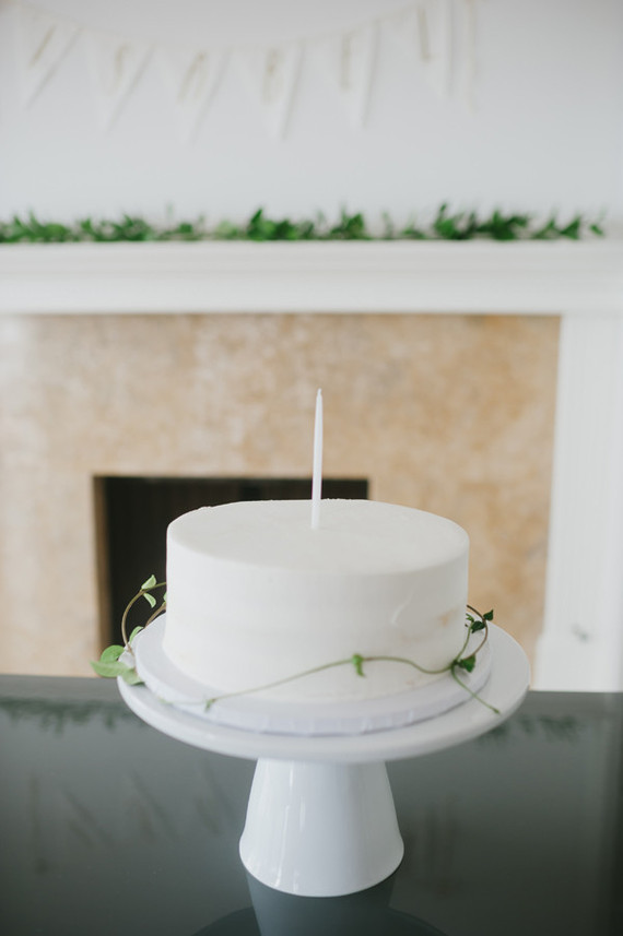 white 1st birthday cake