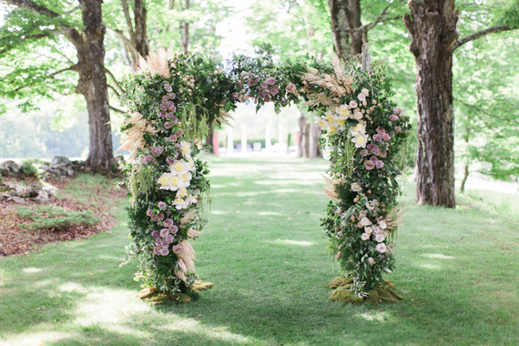 Lush floral ceremony arbor