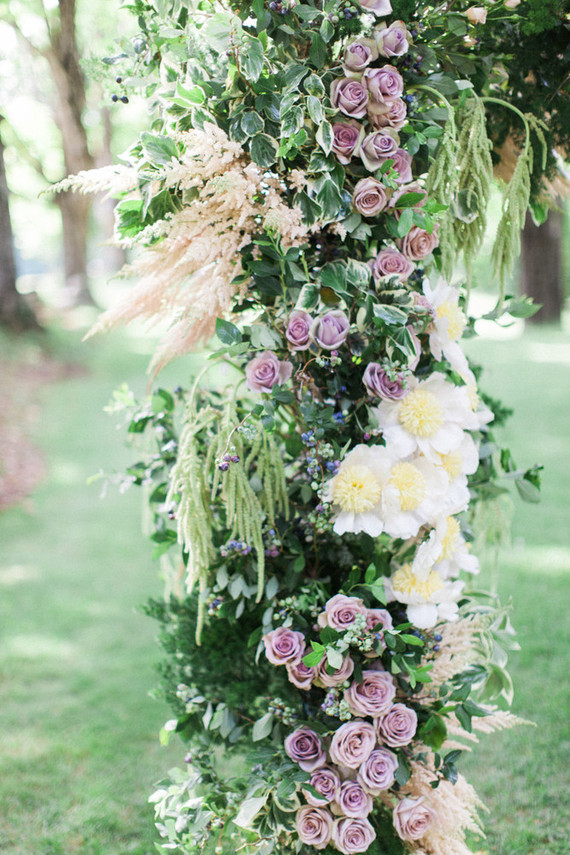 Lush floral ceremony arbor