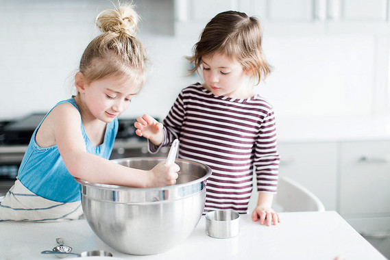 mother daughter baking session at home