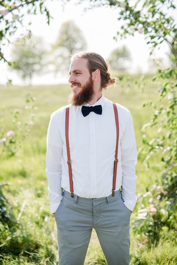 groom with suspenders