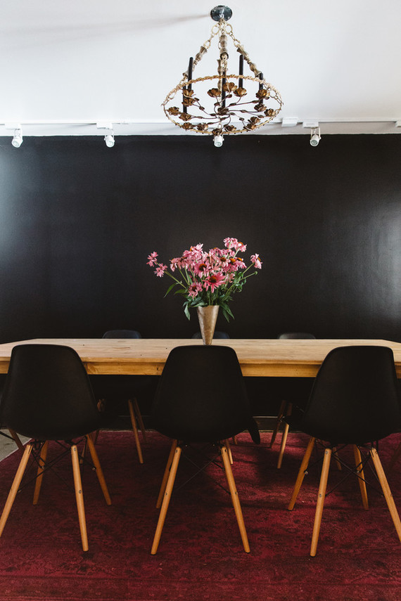 dining room with black wall