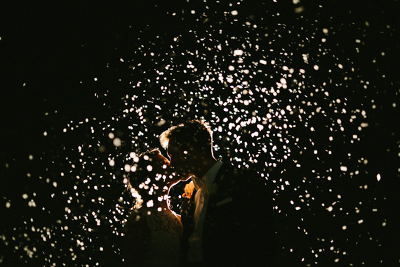 nighttime confetti wedding portrait