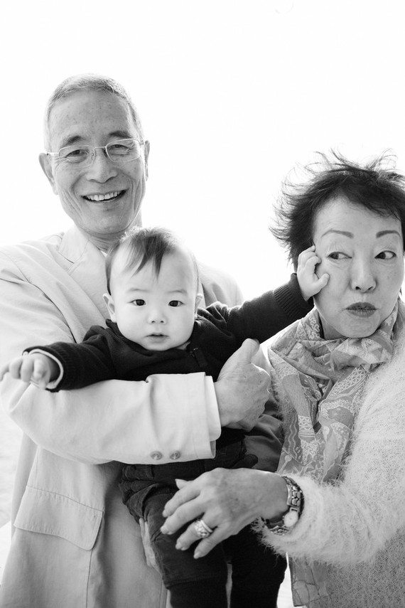 multi generation family photos at the beach