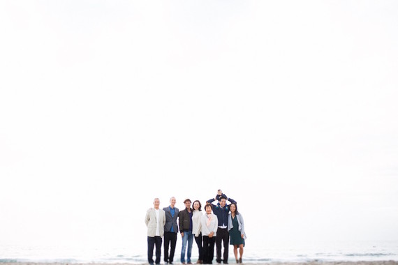 multi generation family photos at the beach