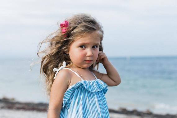 Summery matching sibling photos on the beach