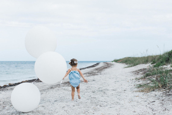 Summery matching sibling photos on the beach