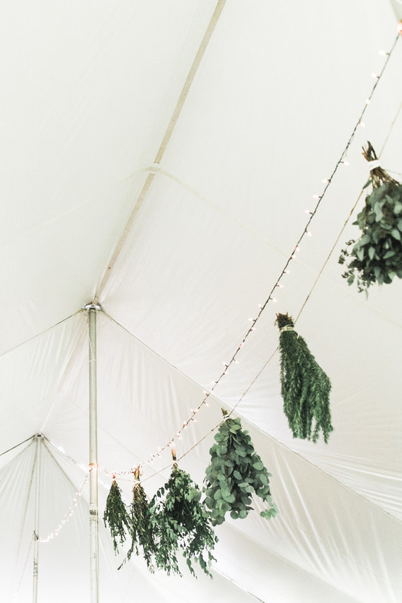 hanging bunches of herbs in wedding decor