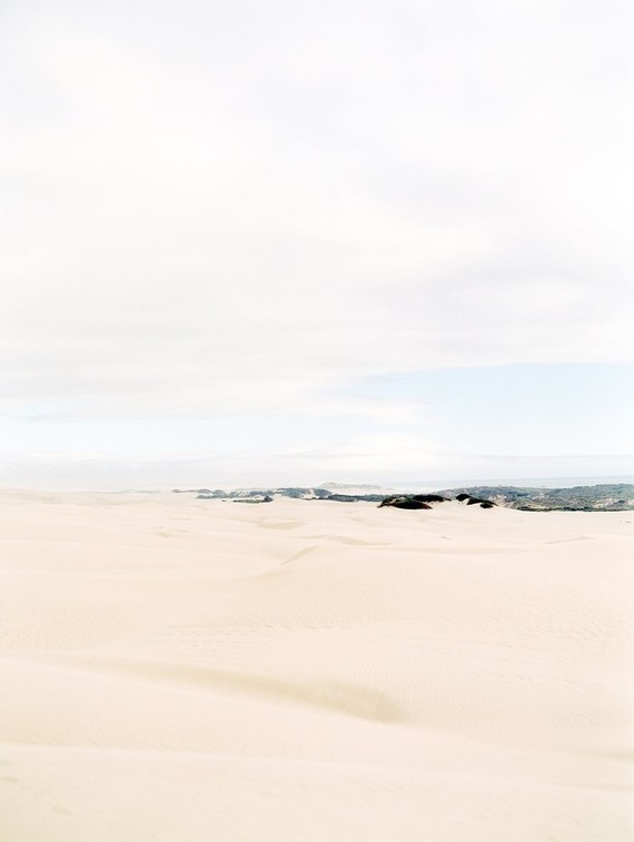 Pastel sand dune engagement photos