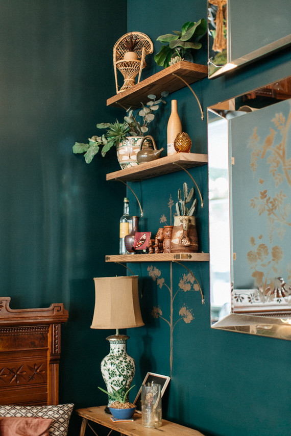 Emerald wall with open shelving