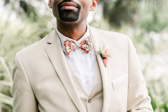 Groom with khaki suit and floral bowtie