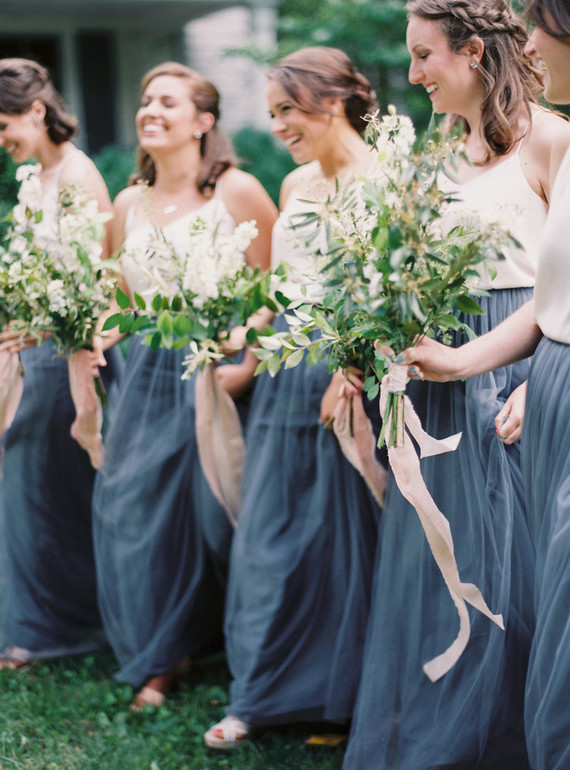 Bridesmaids in blue skirts