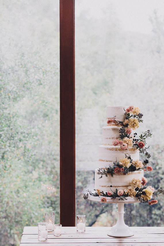Tiered layer cake with strawflowers and chrysanthemums