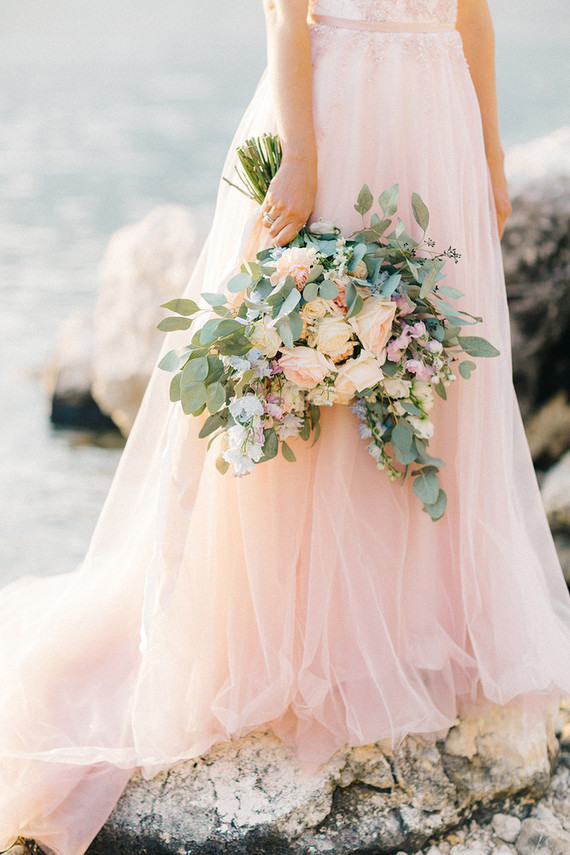 Blush bridal gown and pastel bouquet