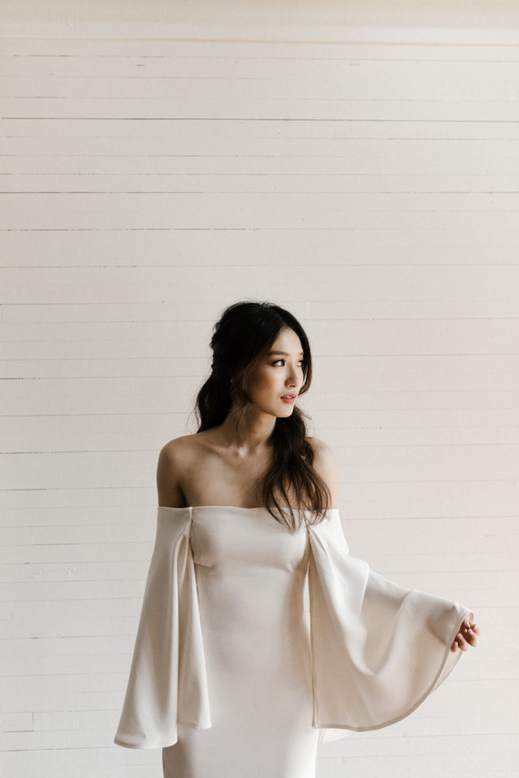 bell sleeved bridal gown