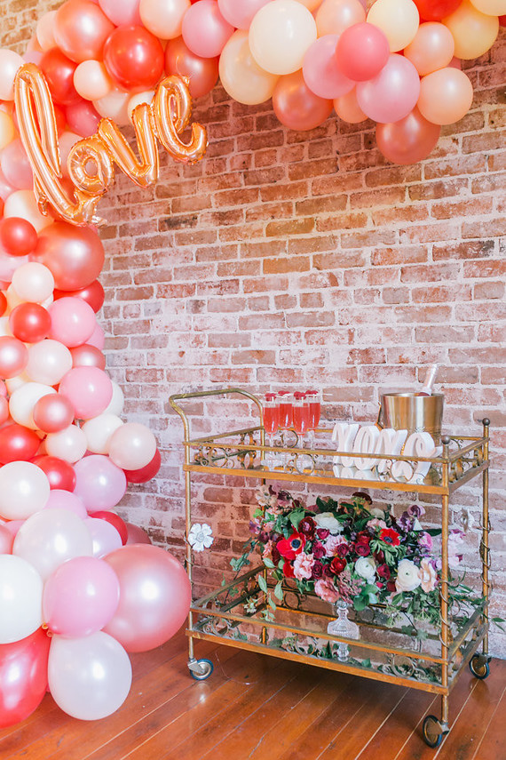 balloon arch and bar cart