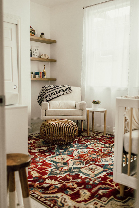 Gender neutral gold and emerald boho nursery