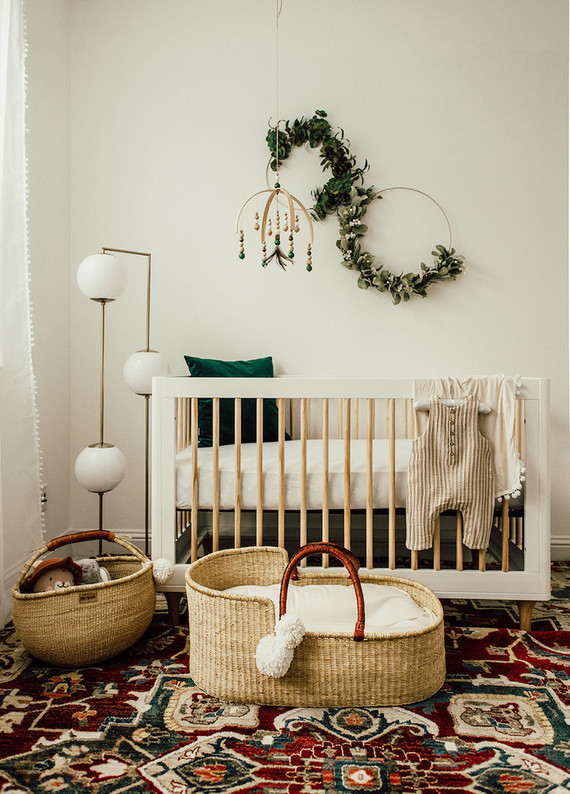 Gender neutral gold and emerald boho nursery