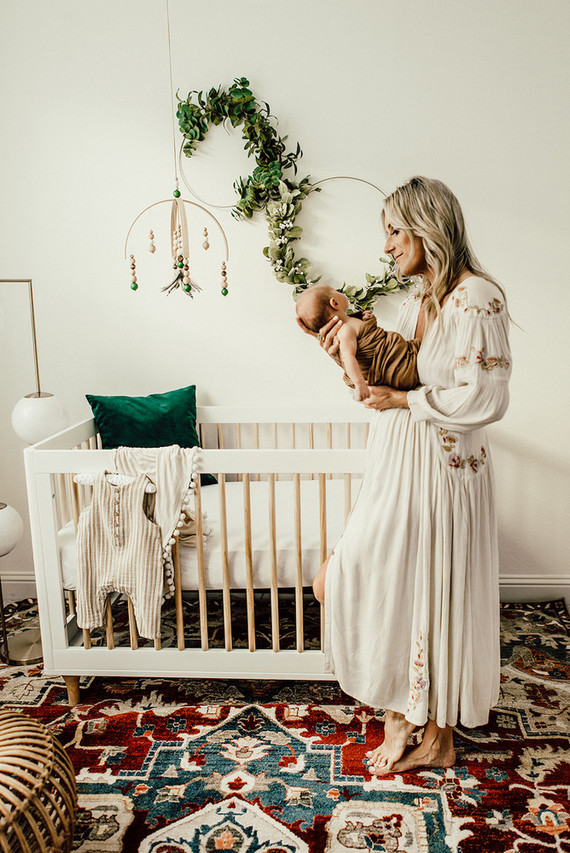Gender neutral gold and emerald boho nursery