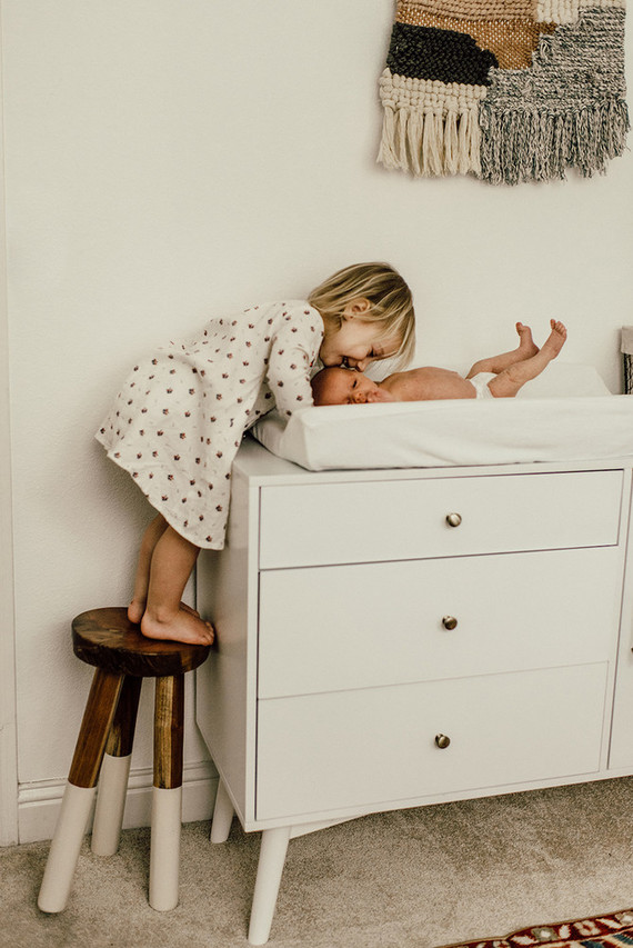 Gender neutral gold and emerald boho nursery