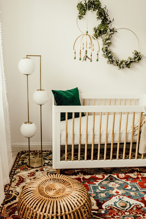 Gender neutral gold and emerald boho nursery