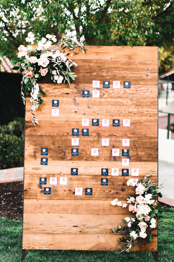 Wood and copper escort card wall