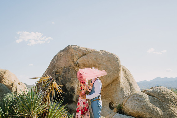 Rustic Joshua Tree wedding with a pink floral dress