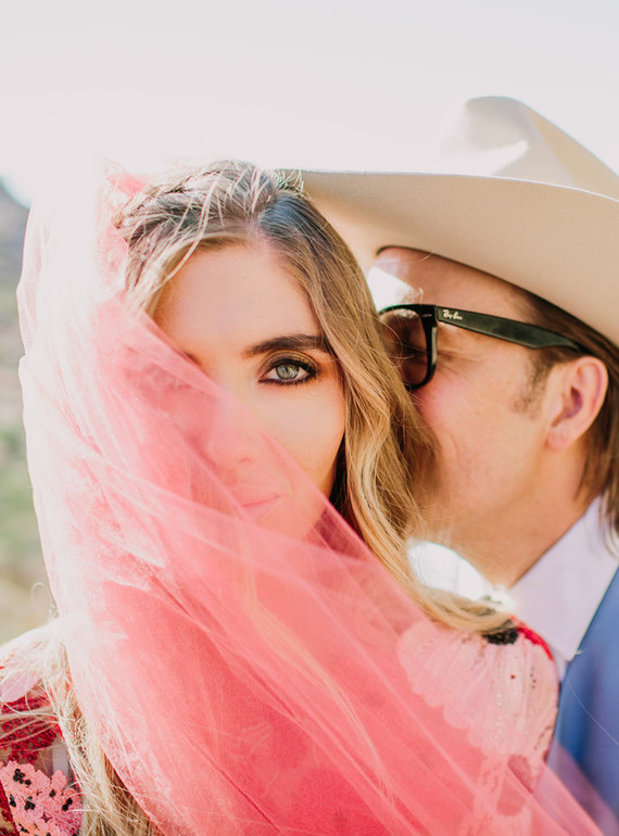 Rustic Joshua Tree wedding with a pink floral dress