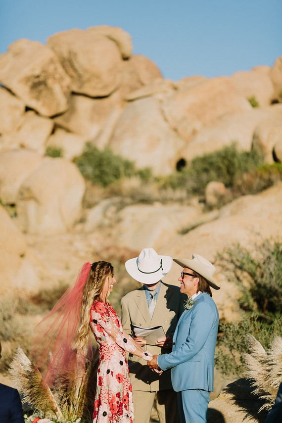 Rustic Joshua Tree wedding with a pink floral dress