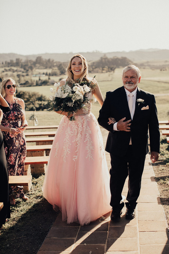 Rustic California wedding with a pink dress