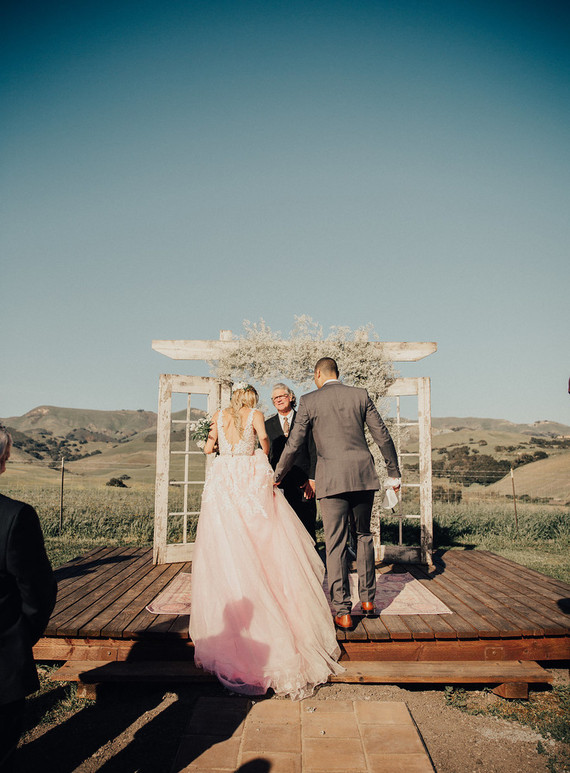 Rustic California wedding with a pink dress