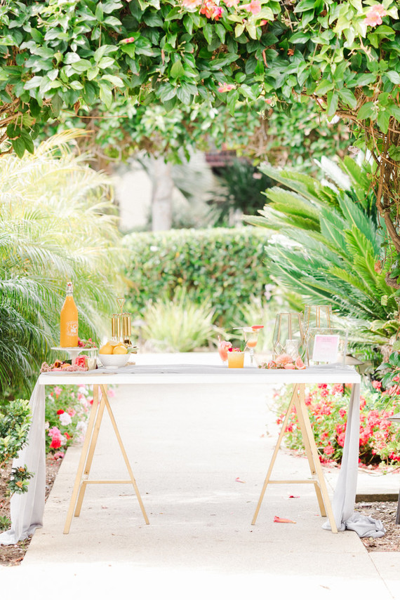 Colorful modern wedding with a killer tropical floral installation