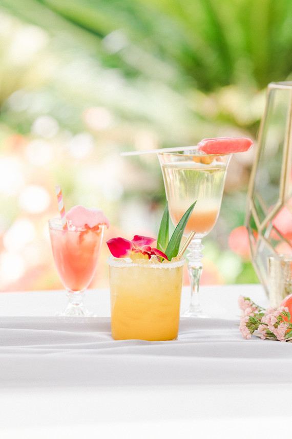 Colorful modern wedding with a killer tropical floral installation