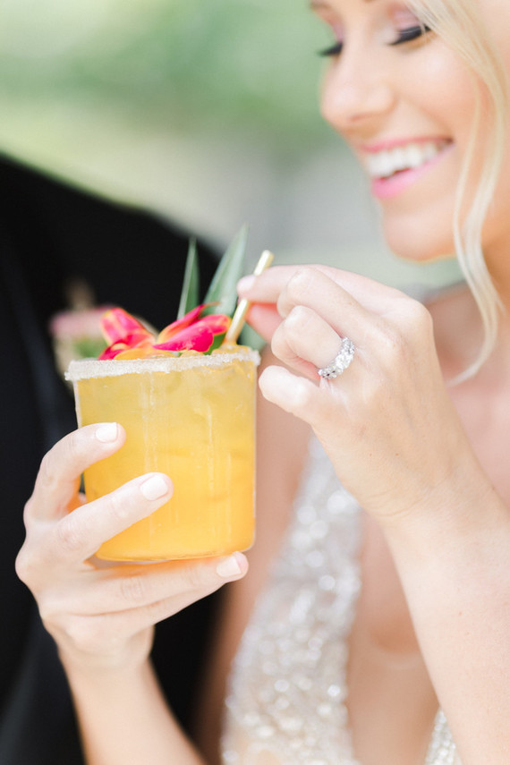 Colorful modern wedding with a killer tropical floral installation