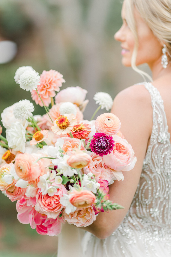 Colorful modern wedding with a killer tropical floral installation
