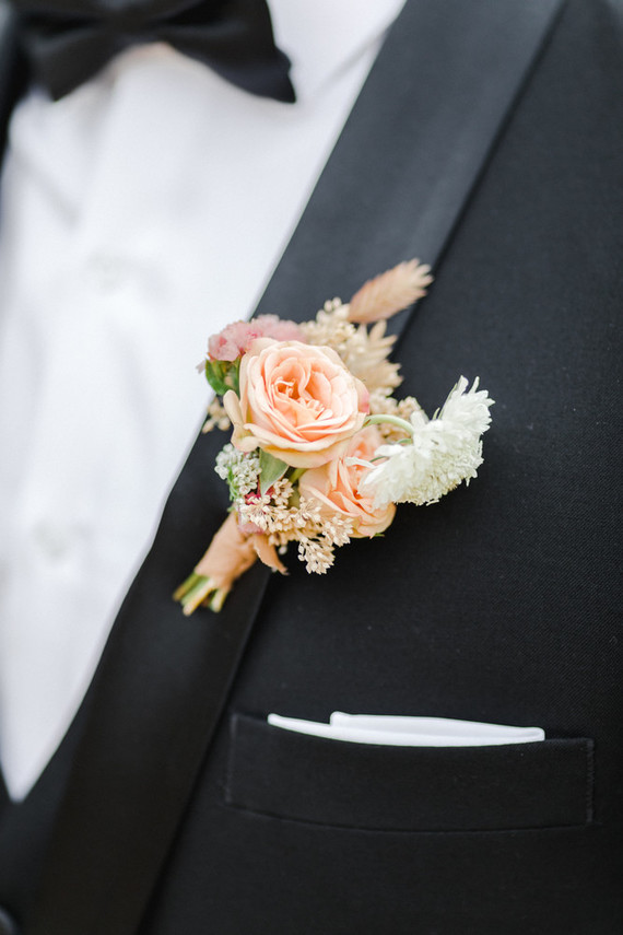Colorful modern wedding with a killer tropical floral installation