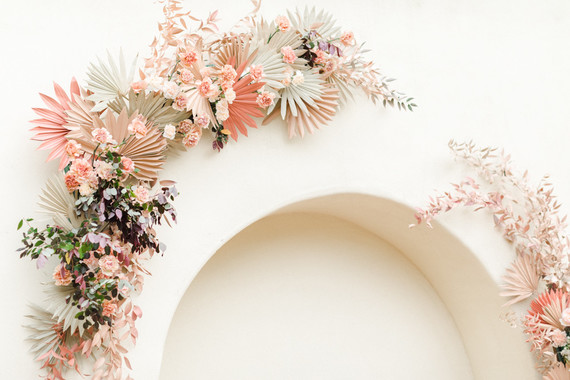 Colorful modern wedding with a killer tropical floral installation