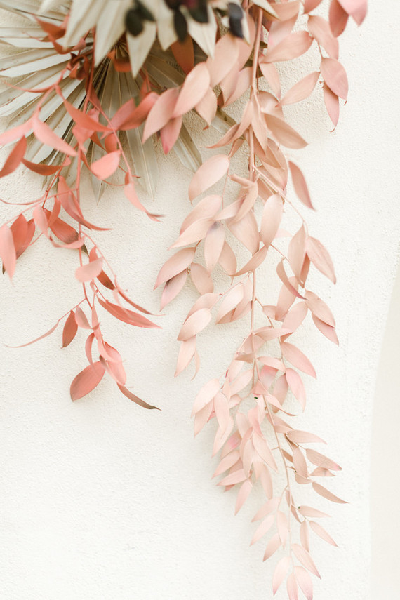 Colorful modern wedding with a killer tropical floral installation