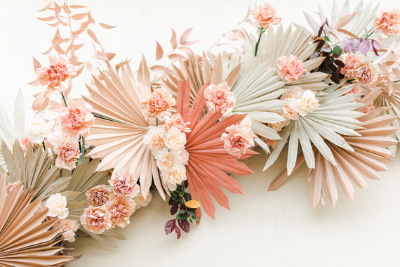 Colorful modern wedding with a killer tropical floral installation