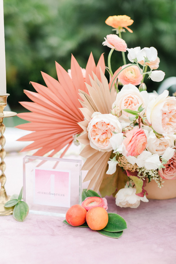Colorful modern wedding with a killer tropical floral installation
