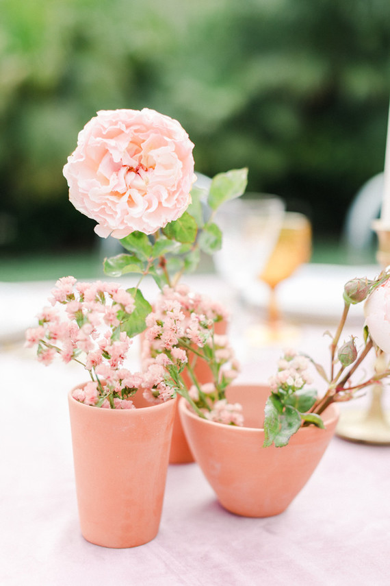Colorful modern wedding with a killer tropical floral installation