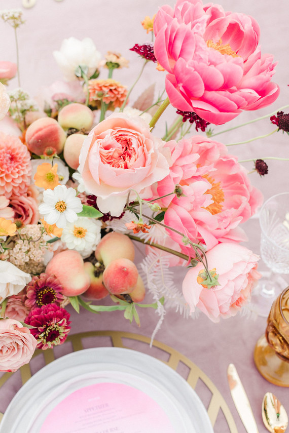 Colorful modern wedding with a killer tropical floral installation