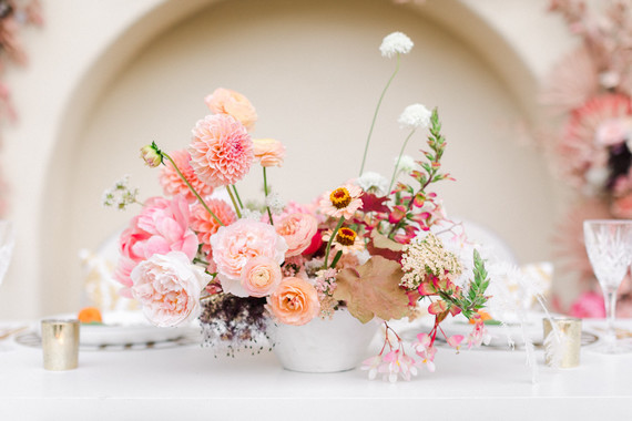 Colorful modern wedding with a killer tropical floral installation